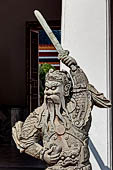 Bangkok Wat Pho, chinese style door guardians of the gallery of the eastern courtyard of the temple compund. 